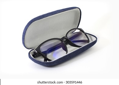 Black retro glasses in opened blue jeans texture case on white background