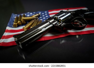 Black Revolver And Ammunition On The Folded United States Flag Is Against The Constitution Of The United States. Violence. Banning The Sale Of Illegal Weapons.