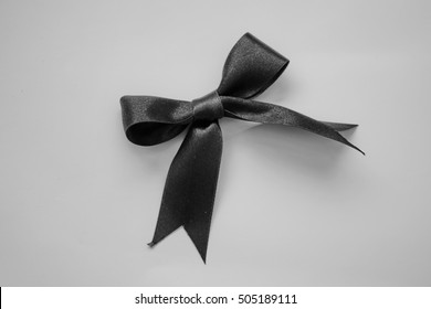  Black Ribbon Bow Symbolic Logo Raising Awareness Of Remembrance Campaign Or Mourning Over Person's Death: Pray For World Peace Concept: RIP,black And White Color.