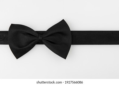 black ribbon bow tie on white background