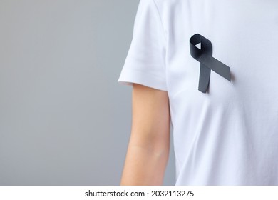 Black Ribbon For Melanoma And Skin Cancer, Vaccine Injury Awareness Month, Grief And Rest In Peace. Healthcare And Racist Concept