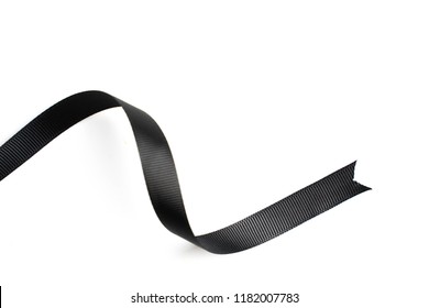 Black Ribbon In Roll On White Background