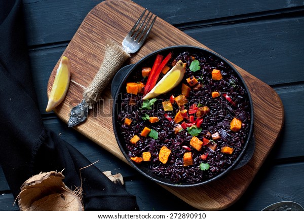 Black rice paella with pumpkin
