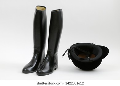 Black Riding Boots And Helmet