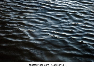 Black river waves texture