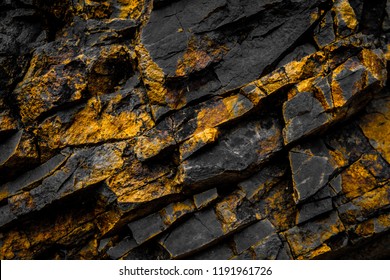 Black Rock Background With Gold  / Yellow Colored Rocks -