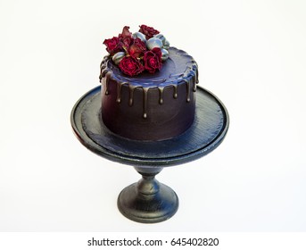 Black Rose Cake On A Cake Stand Isolated On White Background.