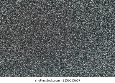 black rough surface The surface of the sandpaper is rough and coarse. rough texture background - Shutterstock ID 2156055659