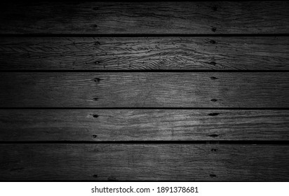 Black rough wooden background or texture