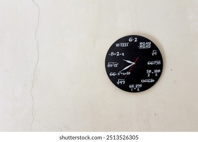 a black round clock with mathematical formulas on a white wall - Powered by Shutterstock - Get 15% off with code: PIKWIZARD15