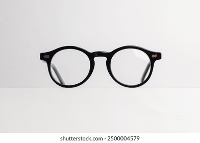 Black round glasses isolated on white background. Plastic glasses frame. Bold glasses frame.