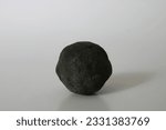 black round manganese nodule from deep ocean sea floor