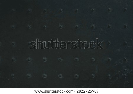 black rubber doormat with dotted pattern                               