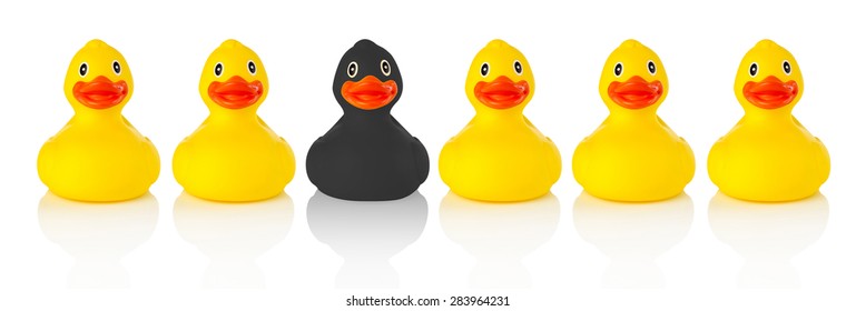 Black Rubber Duck In A Row Of Yellow Rubber Ducks