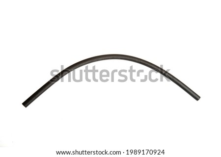 Black rubber fuel hose isolated on white background.