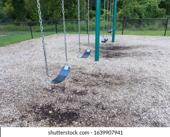 Black Rubber Swing Seats With Swingset And Wood Chips