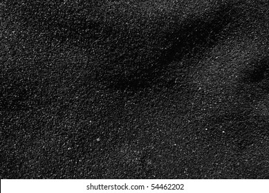 Black Sand beach macro photography.  Shadows play in this evening B&W macro shot of a black sand beach.
