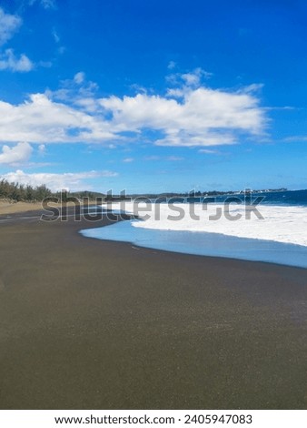 Black sand beach on Reunion - Plage d'Etang Salé. L'Etang Salé beach.