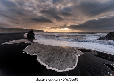Black Sand Beach Reynisfjara in Iceland. Windy Morning. Ocean Waves.
