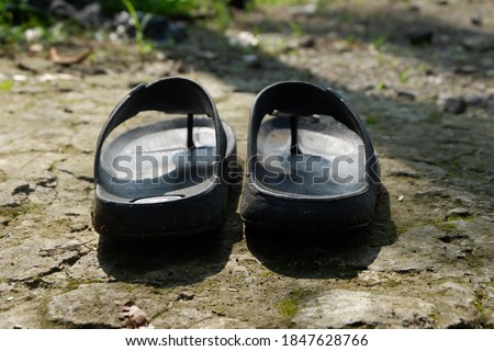 black sandals and sunlight in the morning