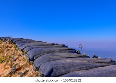 Black Sandbag Bunker With A Beautiful Blue Sky