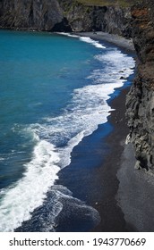 Black sands of Reynisfjara Beach. Coast of the Atlantic ocean near Vik, southern Iceland