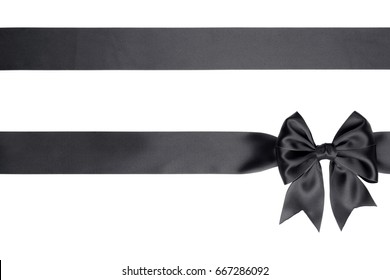 Black satin bow with two horizontal ribbons isolated on white