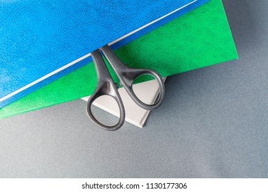 Black scissors in the book.