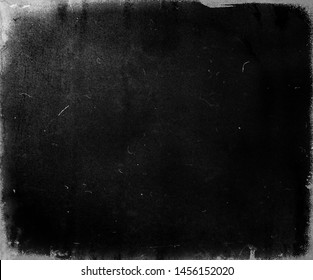 Black scratched grunge movie background, old film effect, scary distressed texture with frame - Shutterstock ID 1456152020