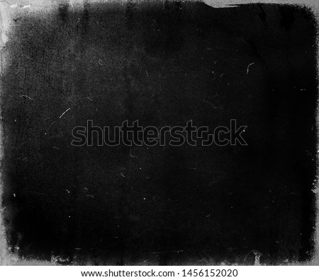 Black scratched grunge movie background, old film effect, scary distressed texture with frame
