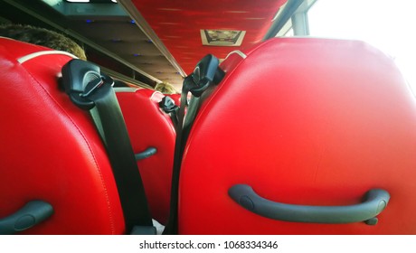 A Black Sefety Belt With Red Seat On The Bus.