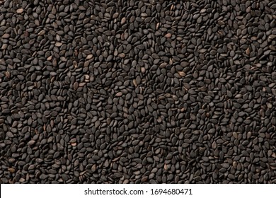 Black sesame seeds close up background
