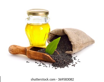 Black Sesame Seeds With Oil. Isolated On White Background.