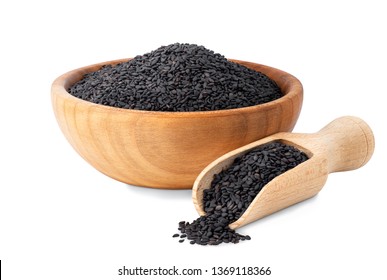 black sesame seeds in wooden bowl and scoop isolated on white background