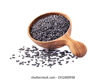 Black Sesame seeds in wooden spoon isolated on white background - Shutterstock ID 1912400938