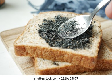 Black sesame spread on a bread 