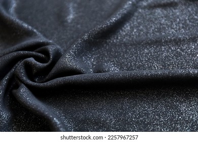 Black shimmering chiffon fabric with folds as texture background - Shutterstock ID 2257967257
