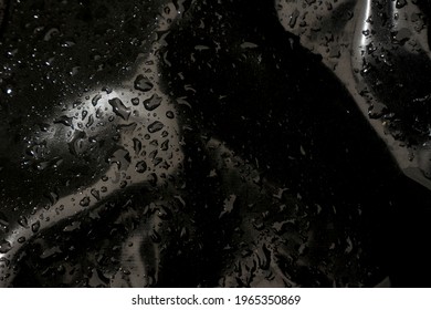 Black shinny textured fabric Latex with water drop on the top