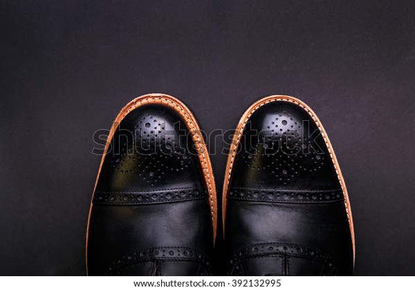 black shoes tan soles