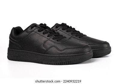 Black shoes isolated on white background. close-up black sneakers or shoes.
