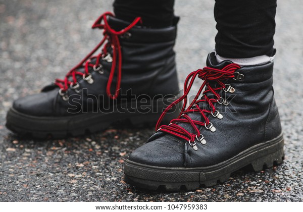 black sneakers with red laces