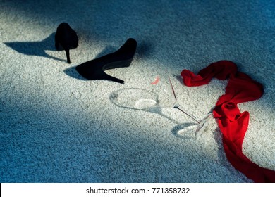 Black Shoes, Red Scarf And Cocktail Glass In Lipstick Dropped On White Carpet.