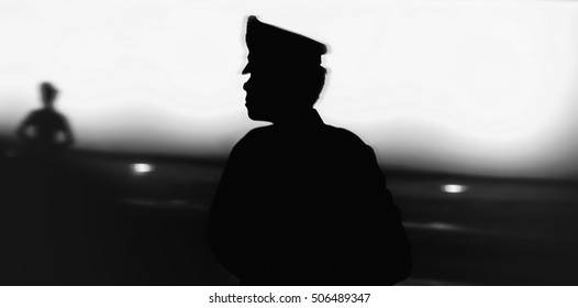 Black silhouette on wall background of a uniformed police officer, Style photo blur