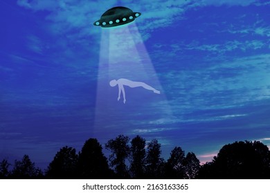 Black Silhouette Of Ufo Spaceship, Man, Earthling In Rays Of Light, Dramatic, Disturbing Situation, Concept Aliens Arrived On Flying Saucer, Mysterious Disappearance Of People, Paranormal Phenomena