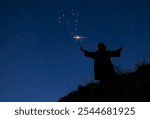 Black silhouette of witch with magic wand isolated on fairy star sky background.Beautiful young woman in black robe and wizard hat conjuring, making witchcraft on hill.Happy Halloween party art design