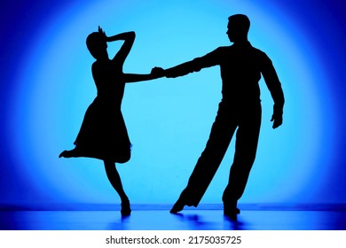 Black silhouettes dance partners performing Argentine tango  Man   woman are dancing choreography elements blue gradient background  Screensaver for school ballroom Latin American dances 