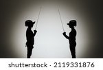 Black silhouettes of two female swordsmen fighting a duel. Athletes cross rapiers and deliver attacking blows. The girls pose in a dark studio on a white background in a spotlight spot. Slow motion.