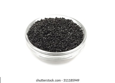 Black Silicon Carbide Powder In A Glass Dish On A White Background