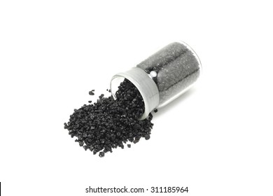 Black Silicon Carbide Powder In A Glass Vial On A White Background