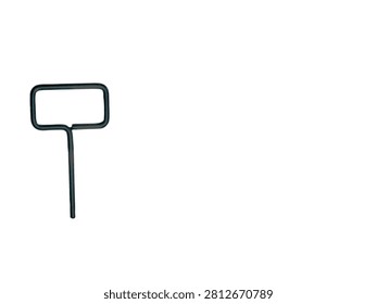 The black SIM ejector is made of metal on a radiant white background 
